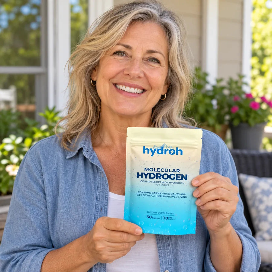 Diane on her porch holding a pouch of Hydroh hydrogen water tablets
